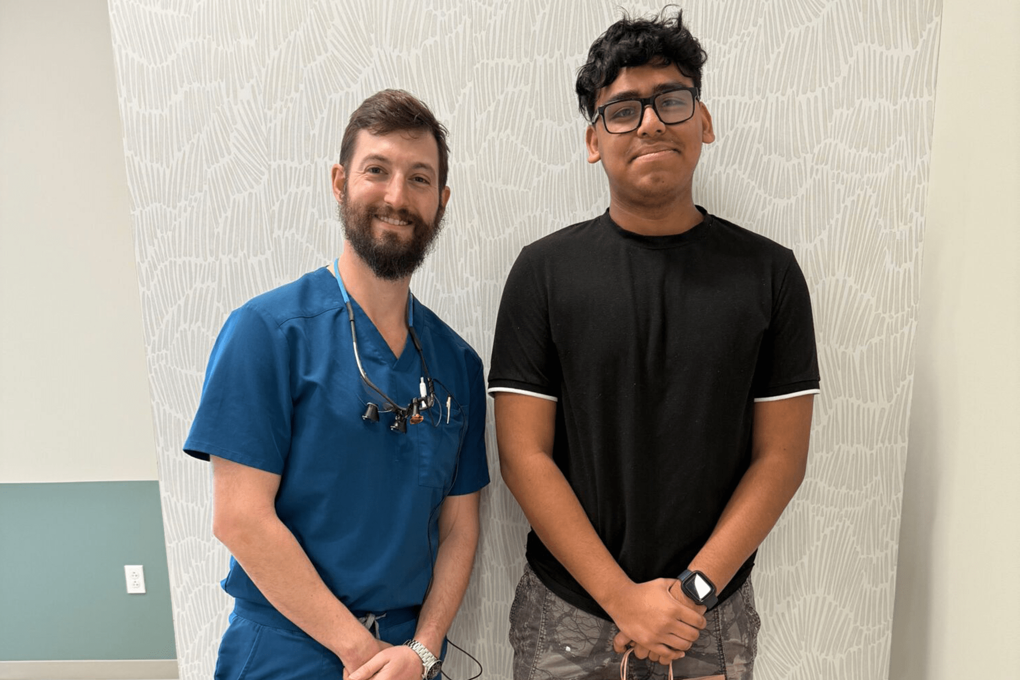 boy and doctor smiling